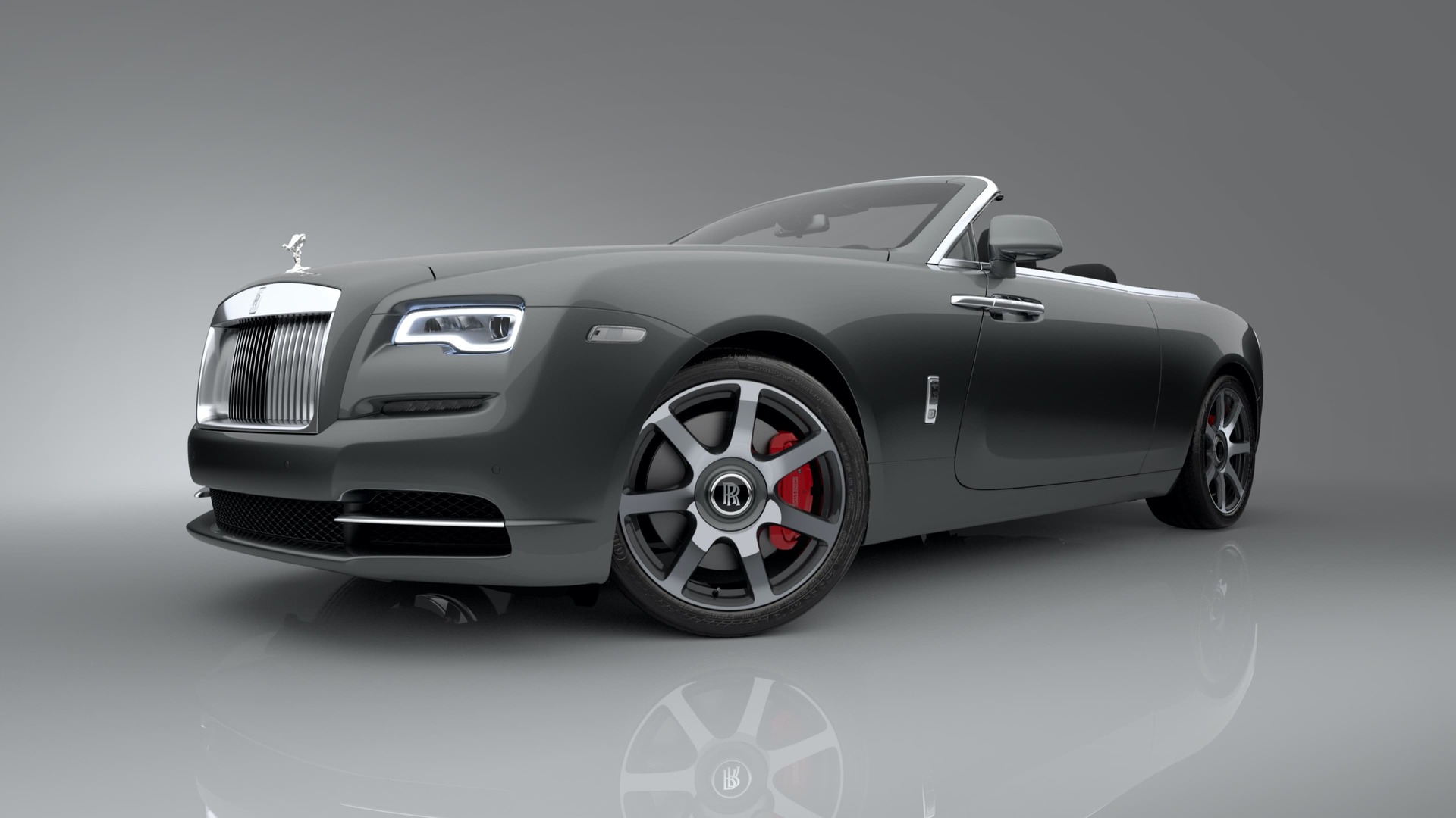 3/4 front exterior of Rolls-Royce Dawn motor car with a brake caliper in a striking red finish.