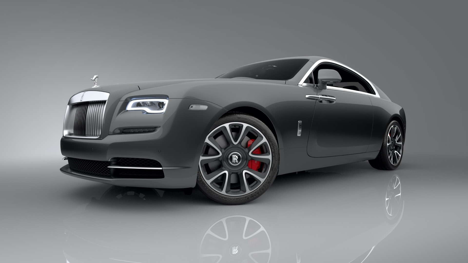 3/4 front exterior of Rolls-Royce Wraith motor car with a brake caliper in a striking red finish.