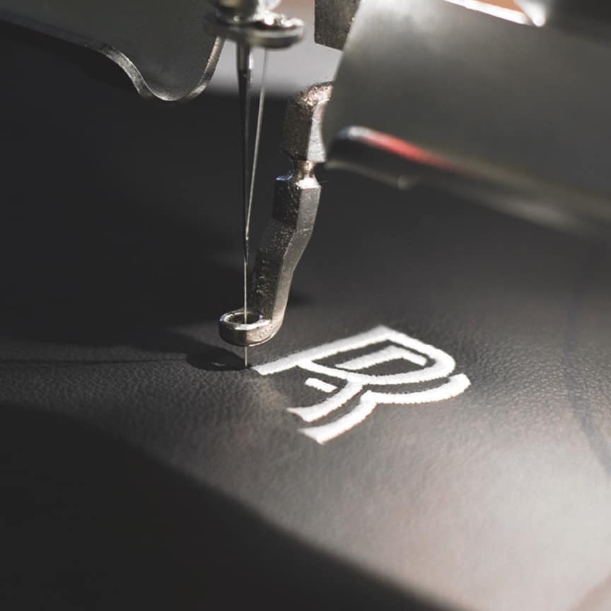 <p>The interlinked RR monogram can be embroidered onto the headrests in your choice of either a colour-matched or contrasting thread.</p>