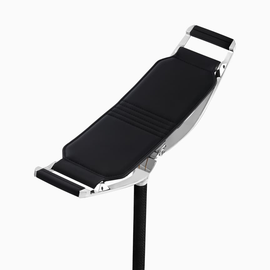 <p>The Pursuit Seat represents the perfect fusion of impeccable design, innovative technology and inimitable Rolls-Royce craftsmanship. Its polished aluminium frame and carbon fibre shaft are strikingly contemporary, while the padded natural grain leather seat is as comfortable as it is refined.</p>
<p>Whether you find yourself at the foothills of mountains or beside the endless swell of the surf, simply deploy the spike and take a seat to embrace all of nature’s majesty.</p>
<p>For voyages into the unknown, the Pursuit Seat comes perfectly equipped. At dawn or dusk, reach beneath the seat to discover a discreetly stowed torch. Effortlessly adjust the seat height at the touch of a button, to allow friends and family to savour the sublime vistas in glorious comfort.</p>