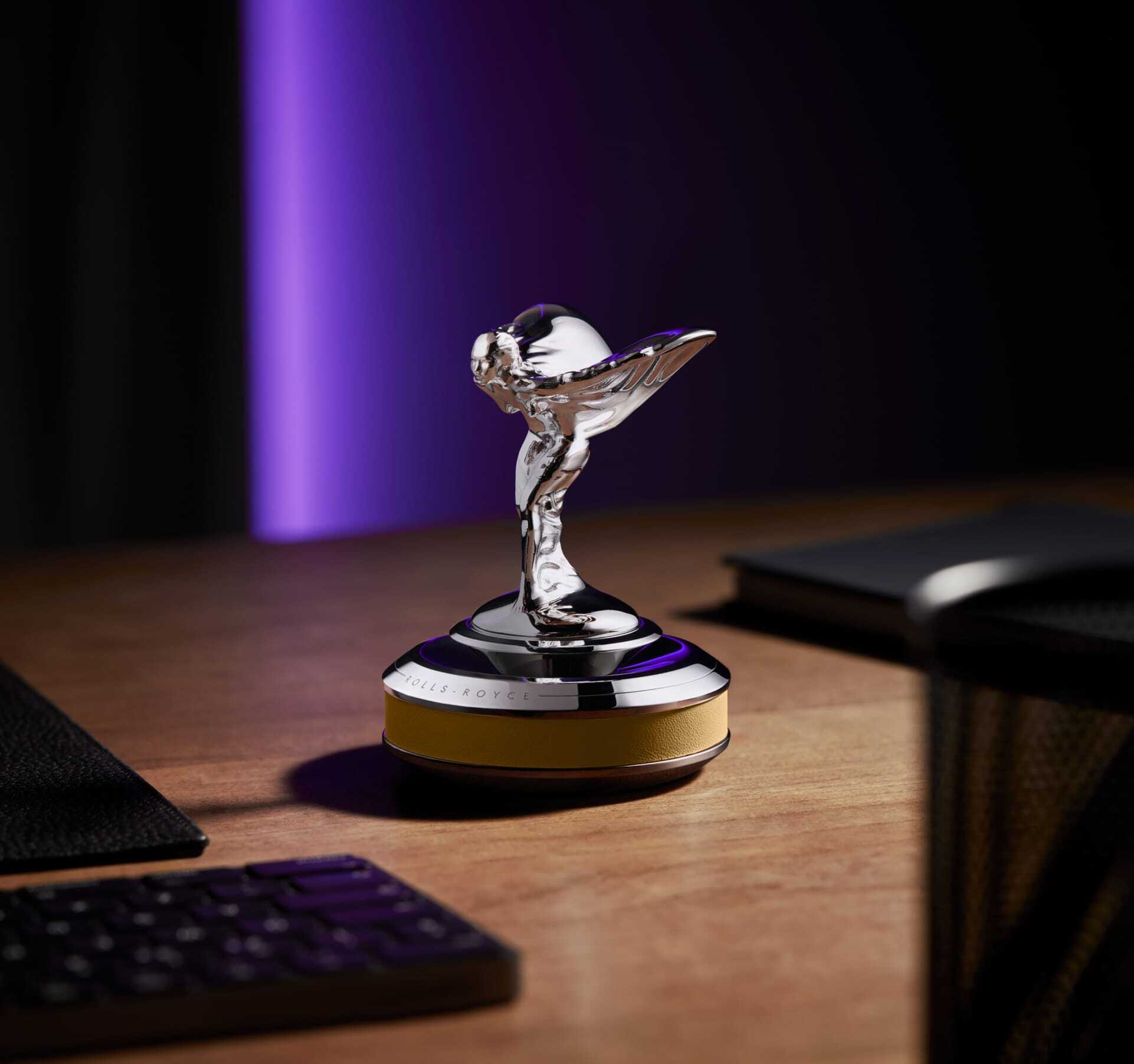Spectre Spirit of Ecstasy in a yellow plinth