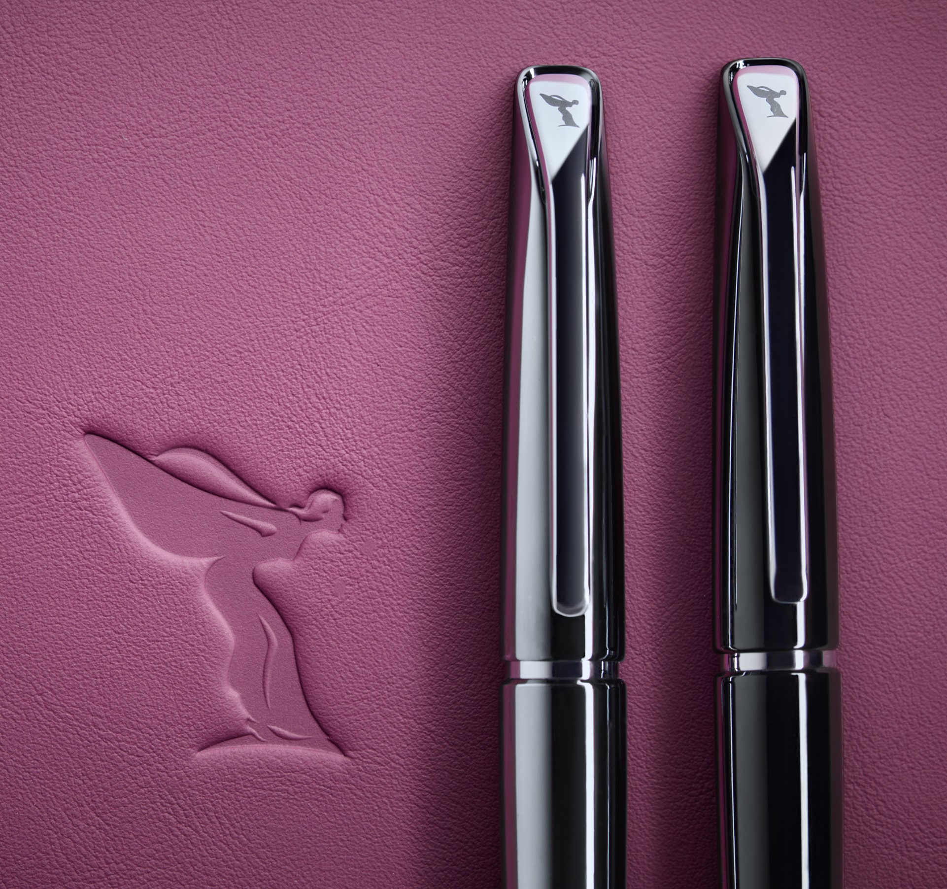 Two Spirit of Ecstasy Ballpoint Pens, one grey and one black