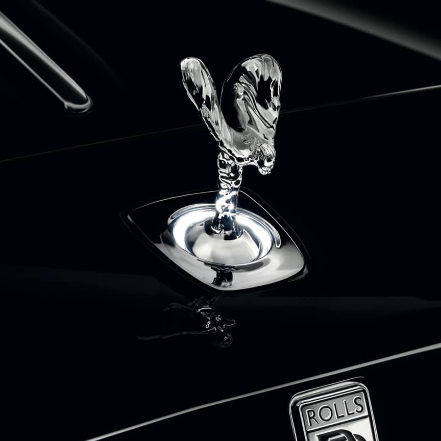 The enchanting Uplit Spirit of Ecstasy with white light halo emanating from the base of the icon