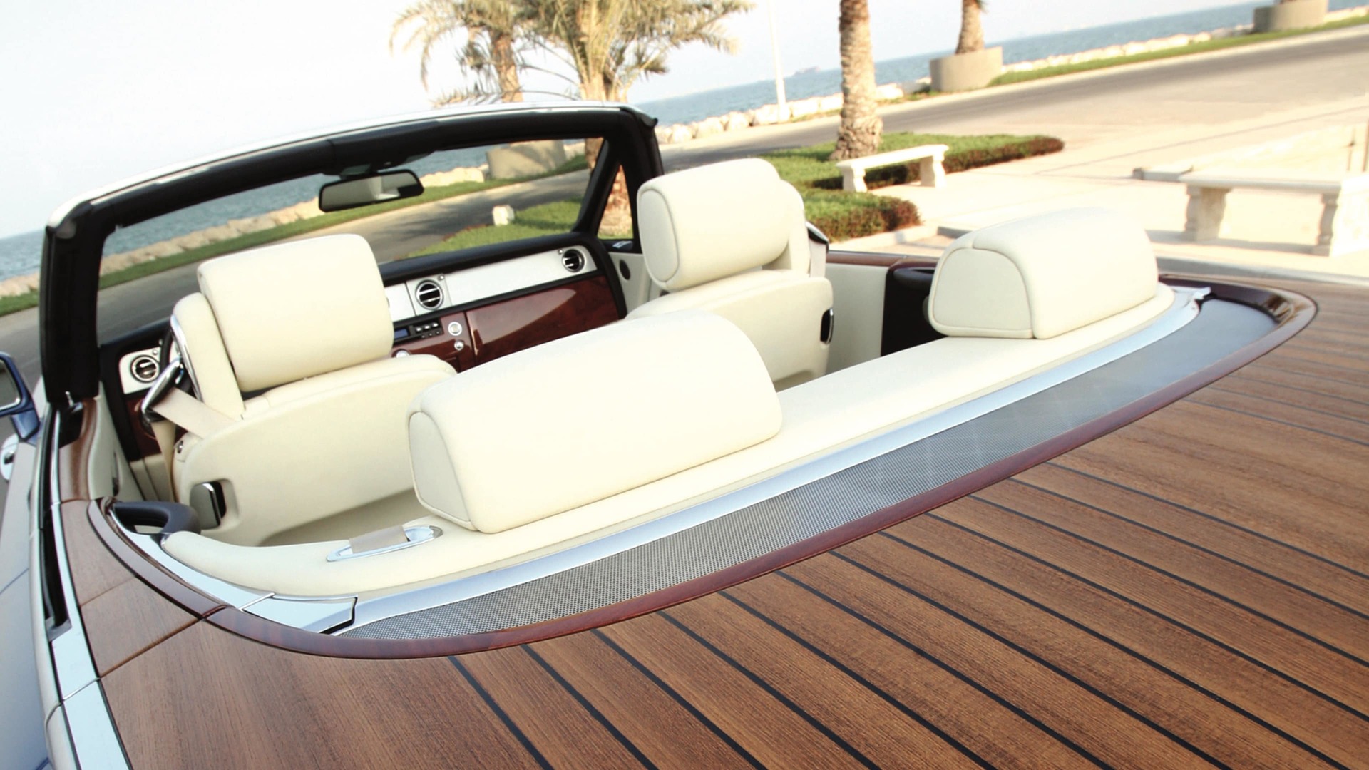 Rear Teak Decking detail on drophead coupé Rolls-Royce motor car by the sea