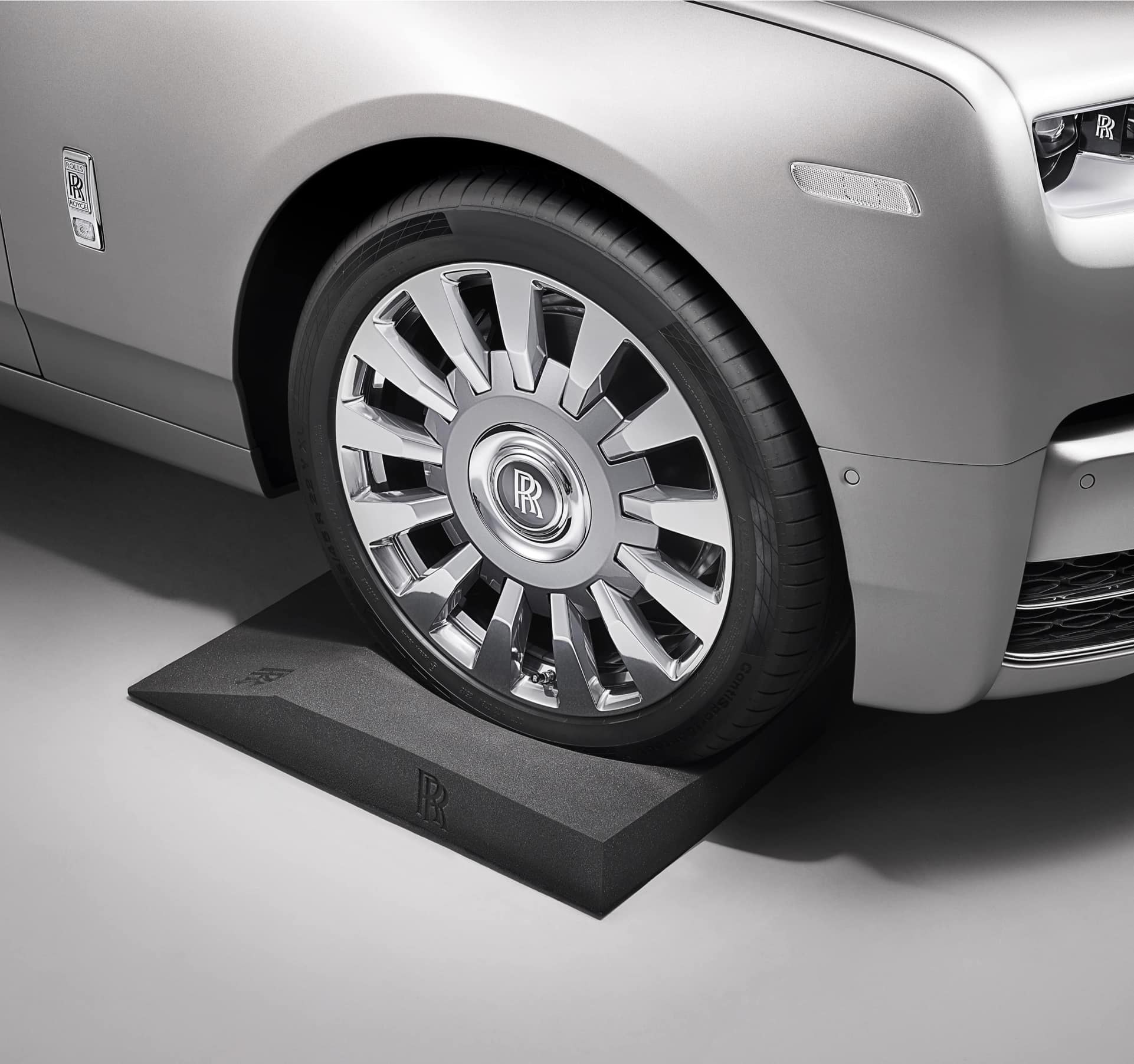 The Rolls-Royce Tyre Cradle, embossed with the Rolls-Royce monogram, is designed for easy mounting and positioning of your Rolls-Royce motor car