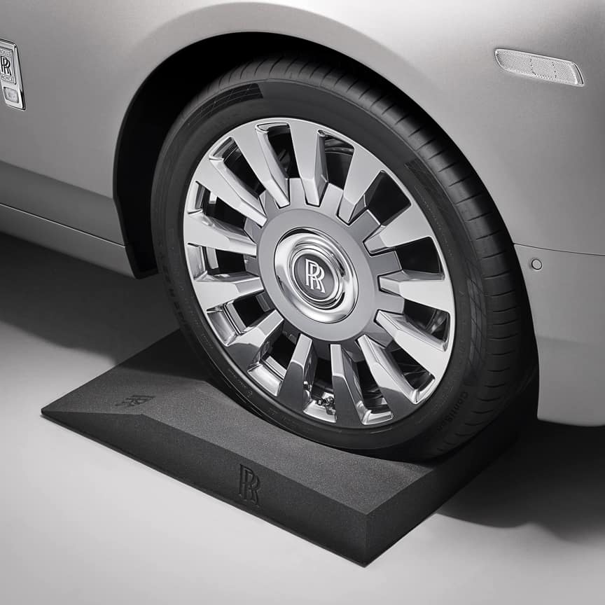 The Rolls-Royce Tyre Cradle, embossed with the Rolls-Royce monogram, is designed for easy mounting and positioning of your Rolls-Royce motor car