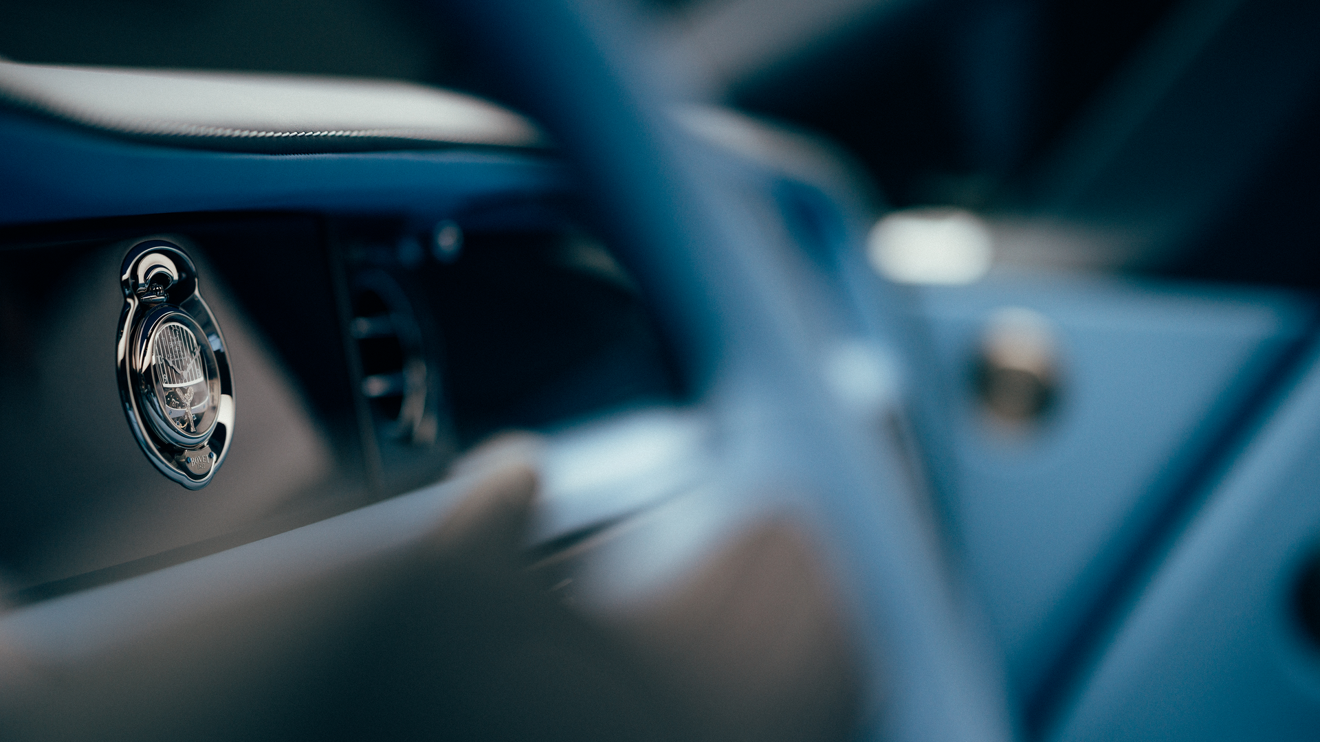 Shot of the interior of a Rolls-Royce car focusing on the dashboard
