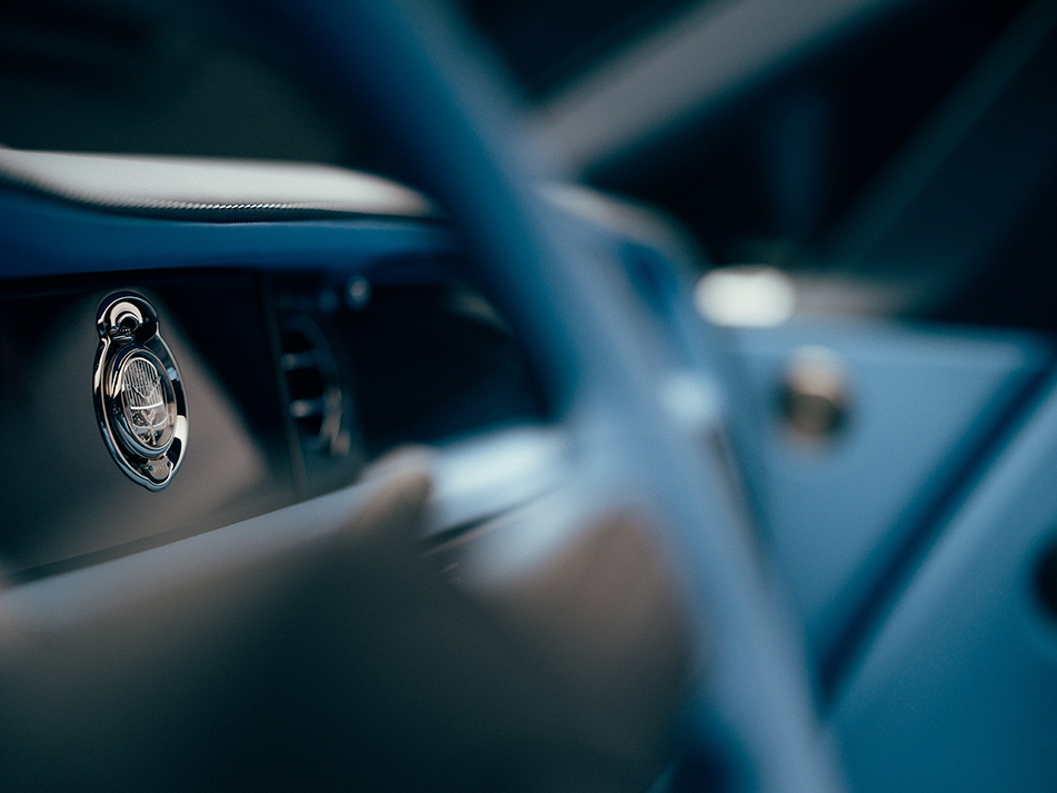 Shot of the interior of a Rolls-Royce car focusing on the dashboard