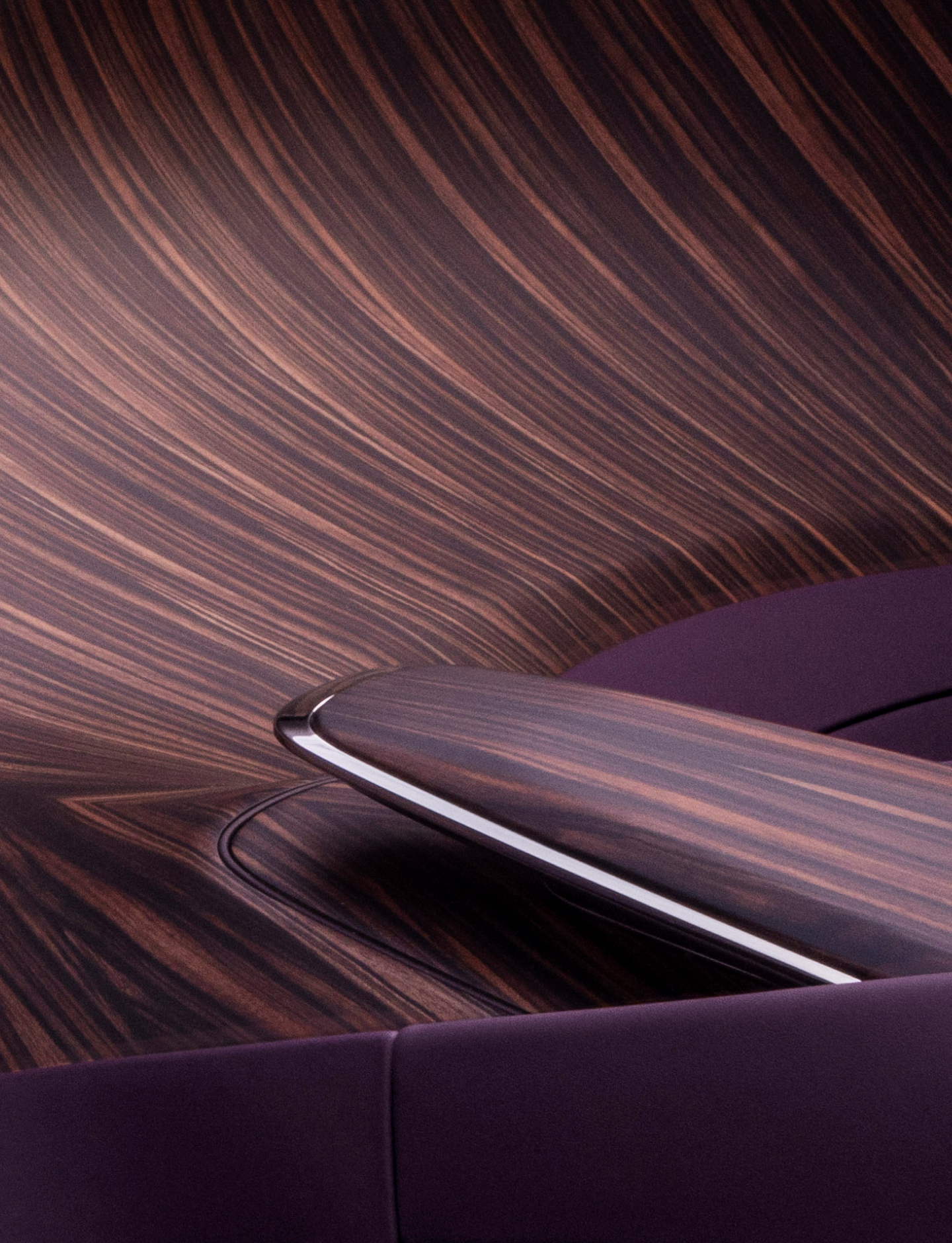 Cantilevered ‘plinth’ centre armrest done with Calamander Light wood