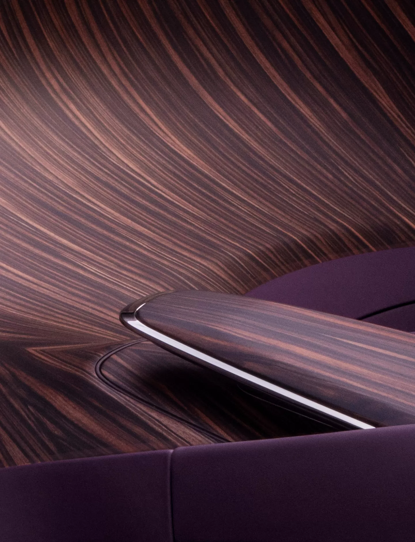Cantilevered ‘plinth’ centre armrest done with Calamander Light wood