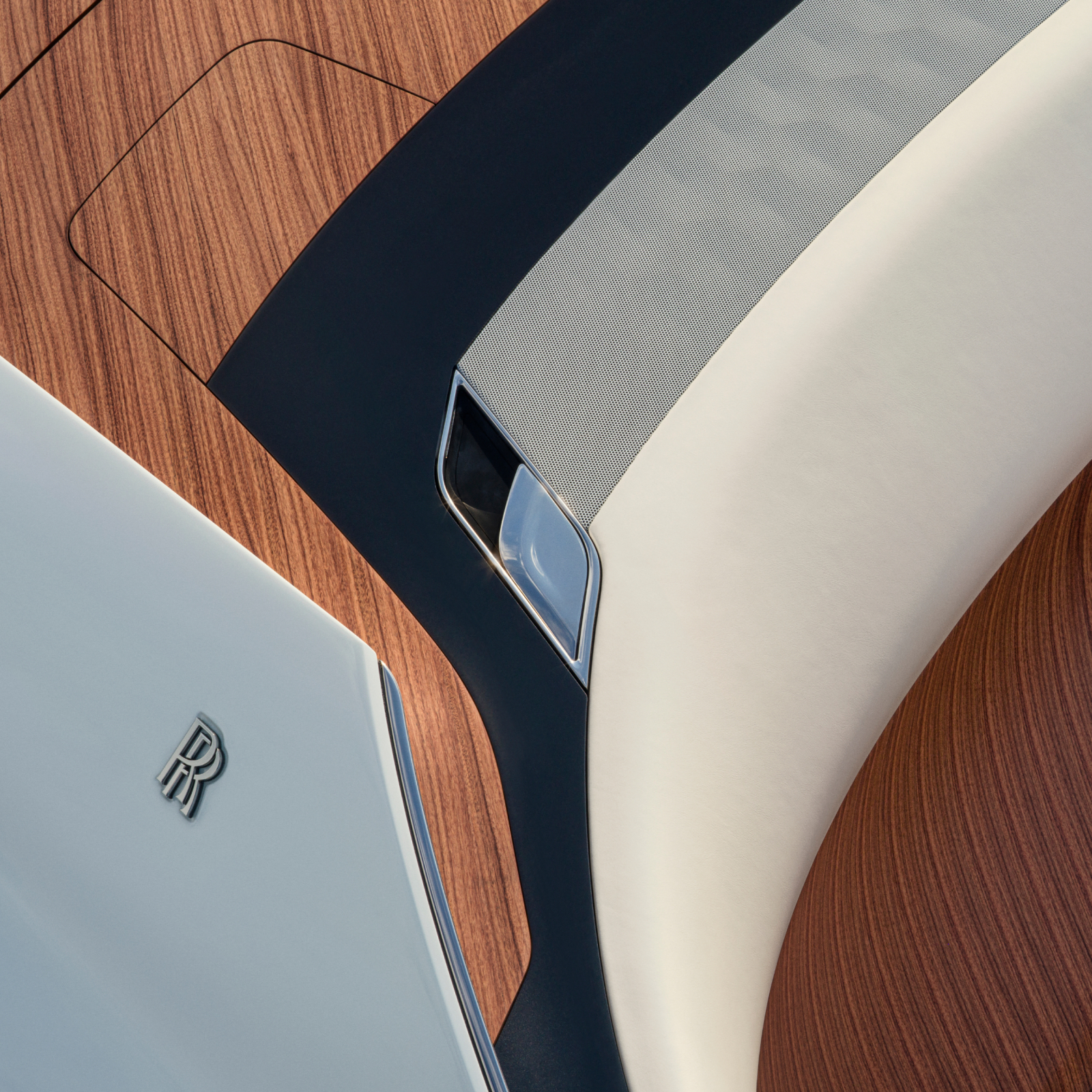 Close up of the Arcadia Droptail rear interior wood paneling and Rolls-Royce monogram