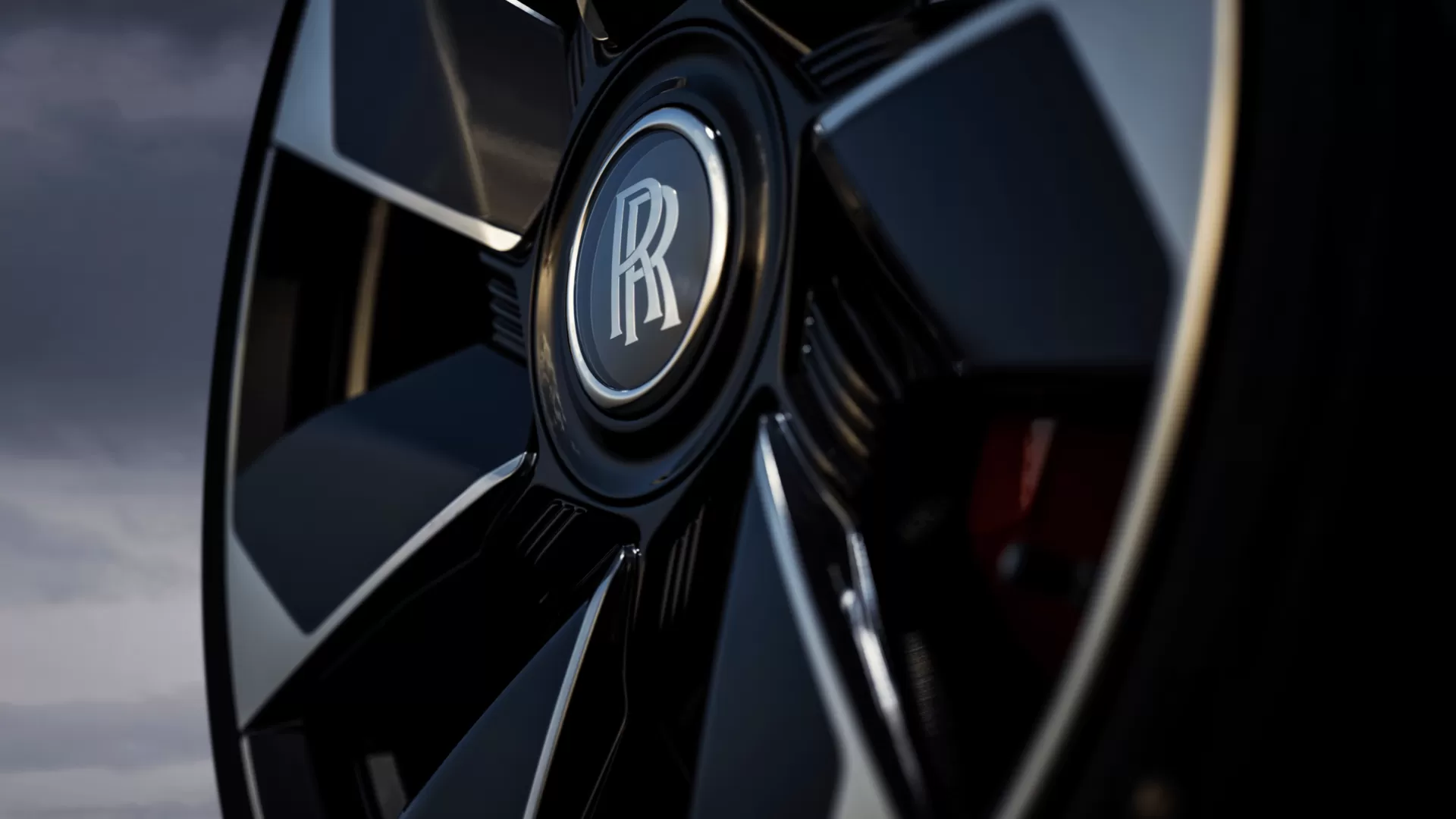 Detailed view of a wheel with the Rolls-Royce monogram on it