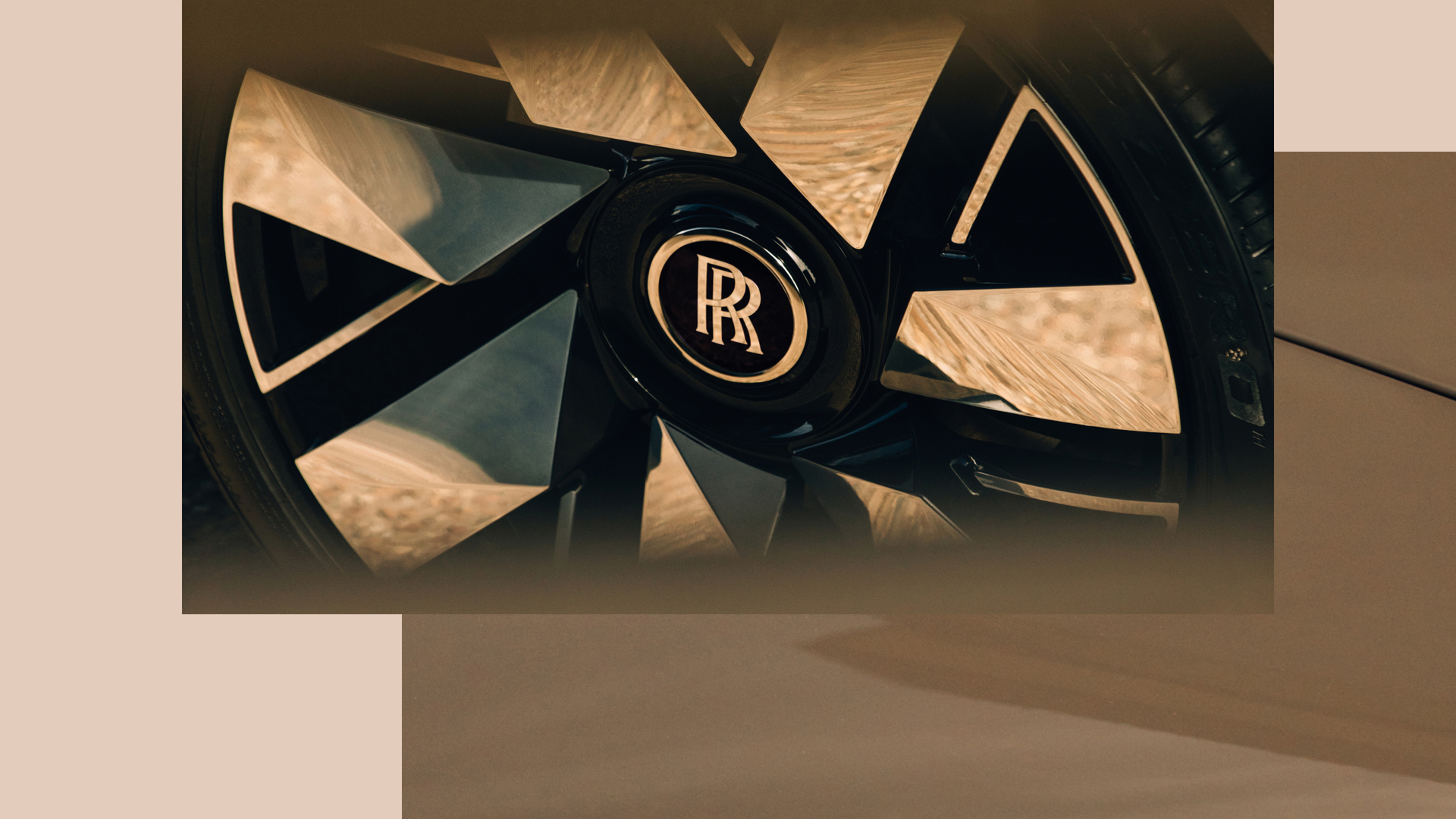 Rolls-Royce monogram in the center of the wheel