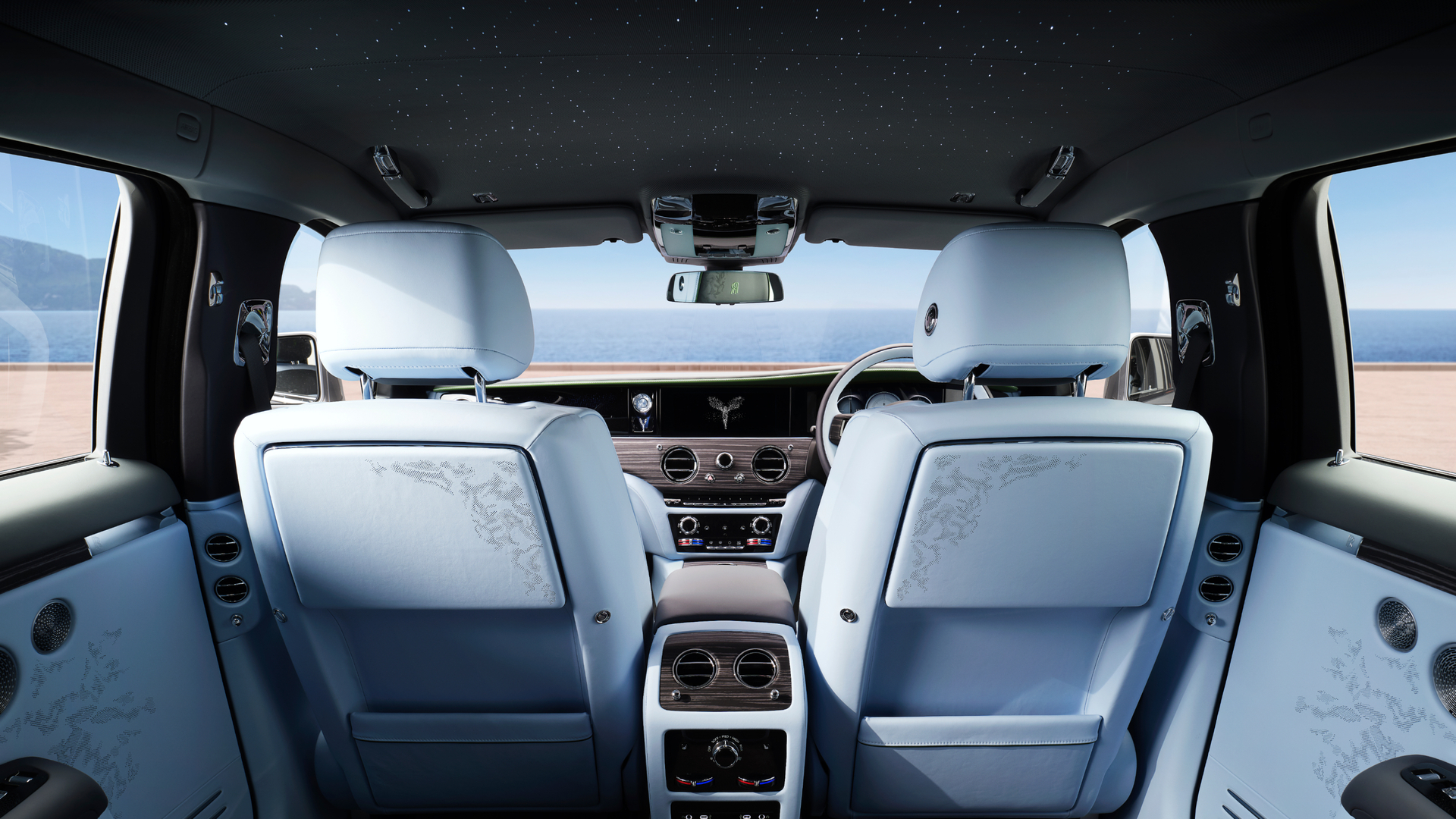 Backseat view of driver and passenger seat of the GSII Extended. light blue interior.