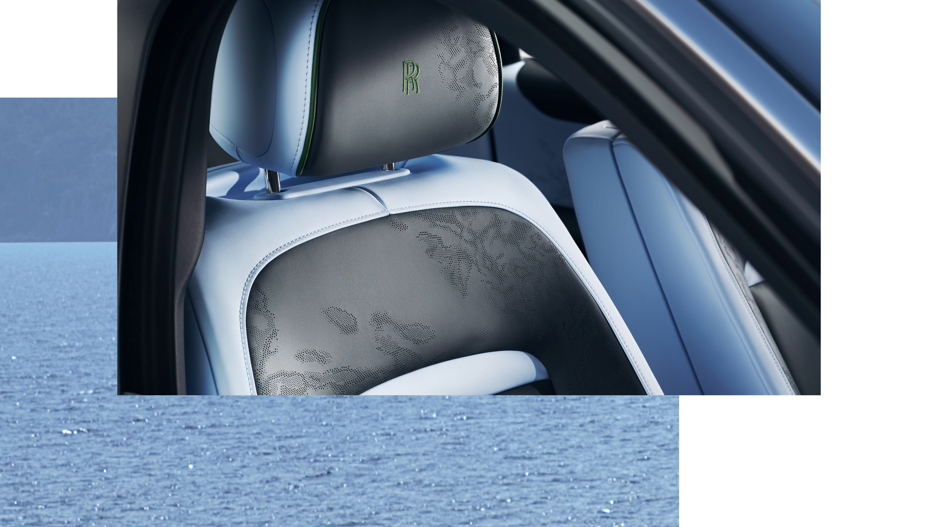 Close up of the Ghost Extended SII car seat showing the green RR logo and floral indents into the car. With a sea backdrop below it. 