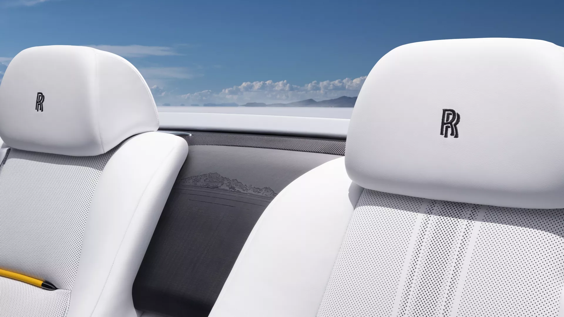 Interior of the Dawn rear seats showing the track guide and waterfall engraving features