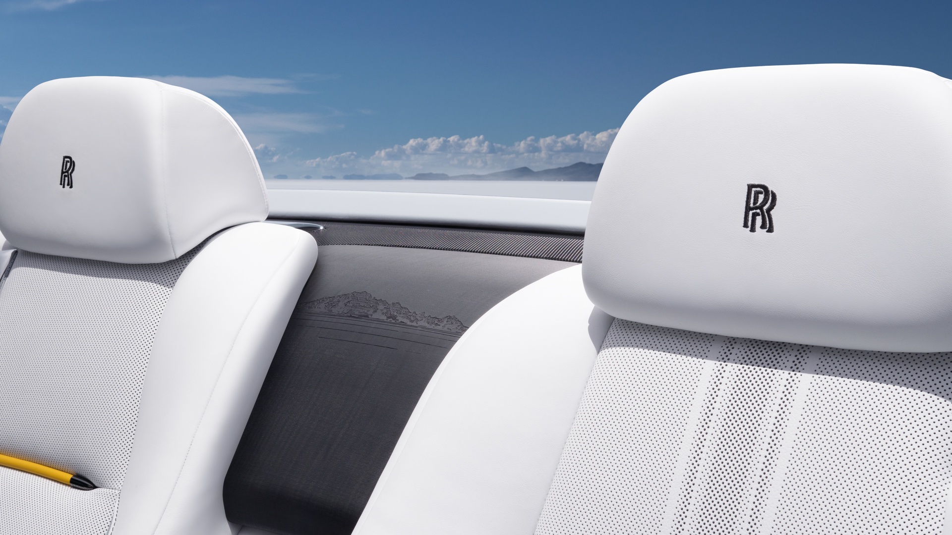 Interior of the Dawn rear seats showing the track line and waterfall engraving features