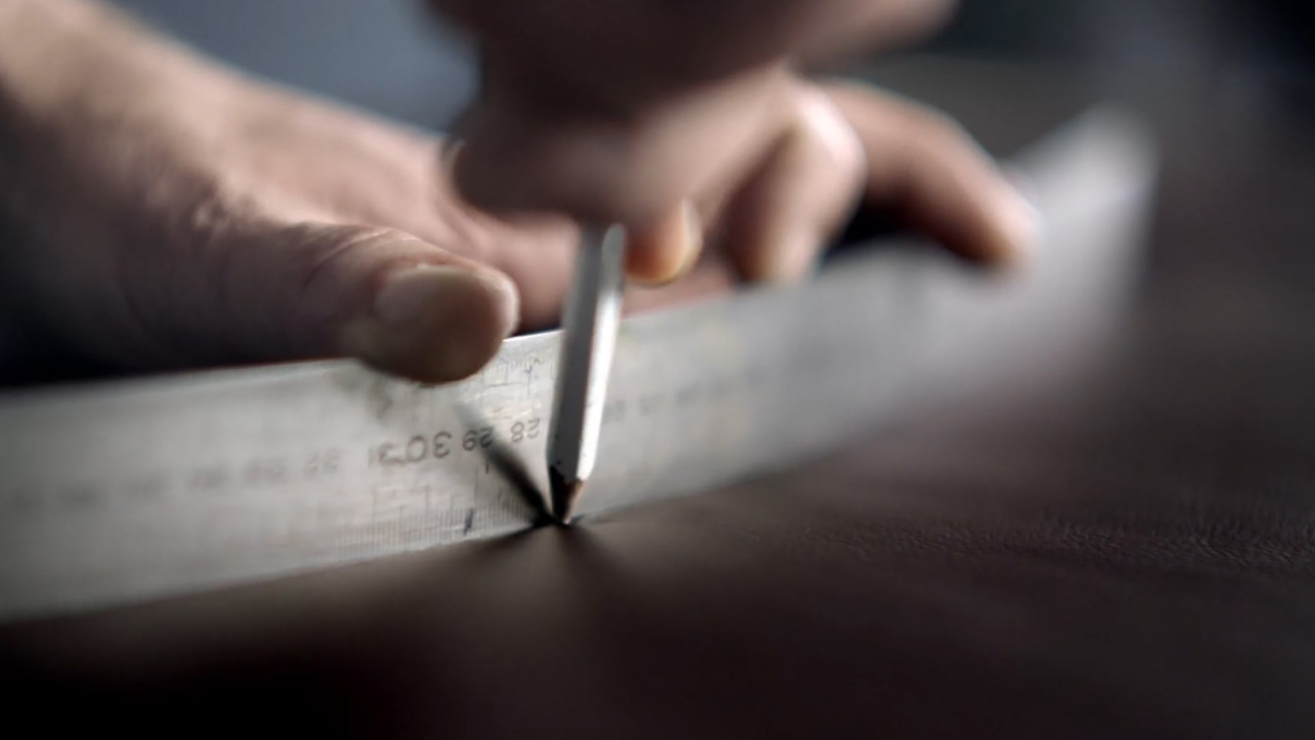A man working with a measuring tape