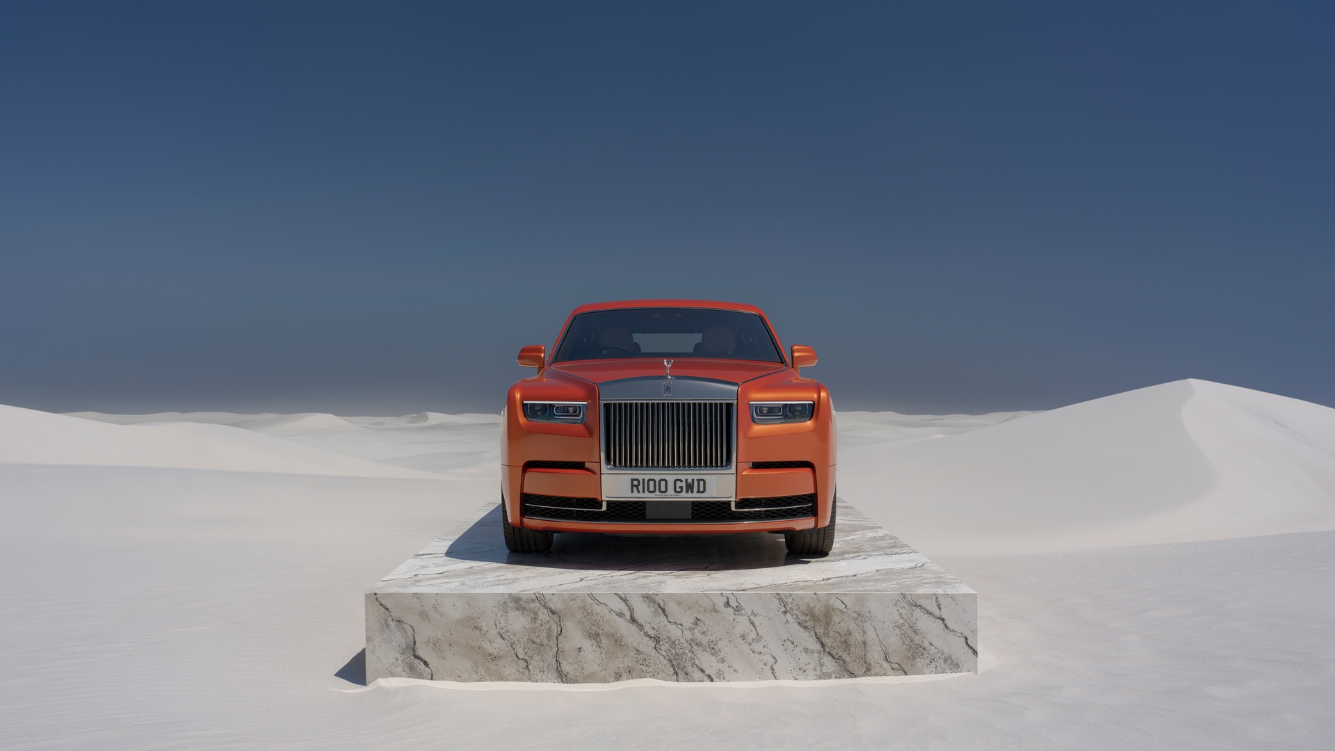 Front on of an Orange Phantom on a slab of marble in the middle of the desert 