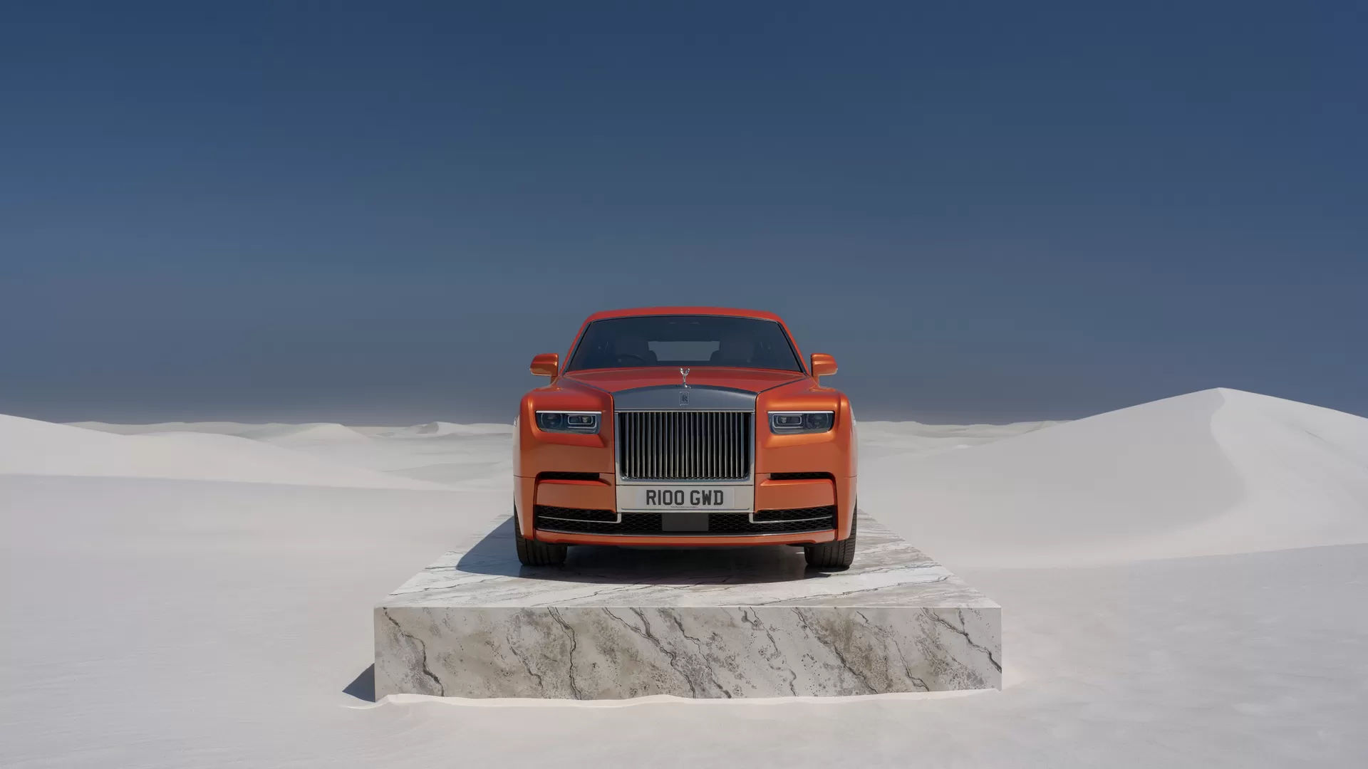 Front on of an Orange Phantom on a slab of marble in the middle of the desert 