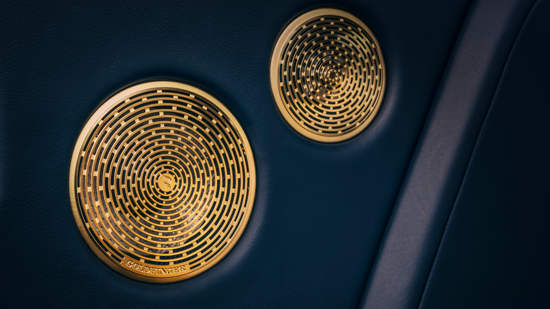 Image of the gold speakers inside of Phantom Goldfinger. 