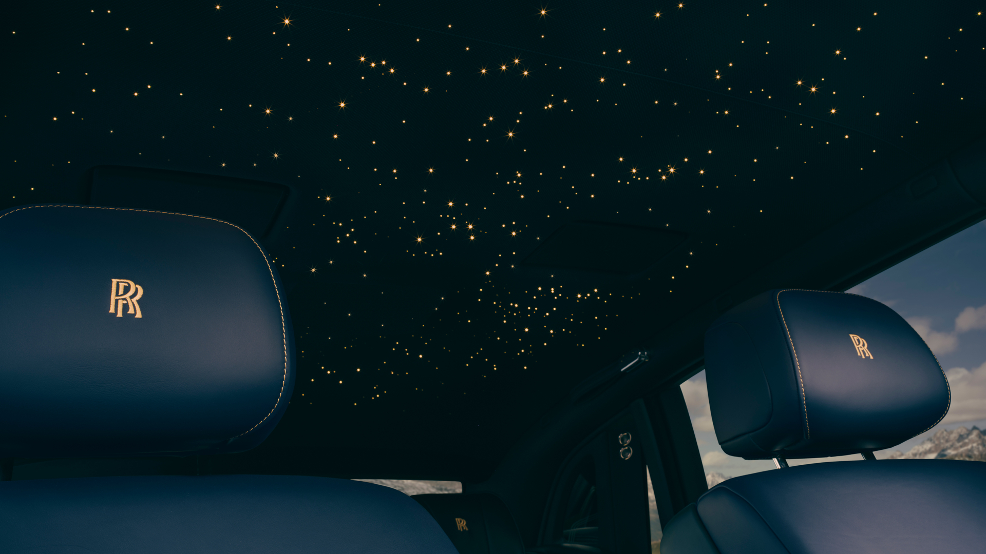 Close up of inside of the Phantom Goldfinger showing the black leather seat with gold stitching. The stars in the roof are gold.