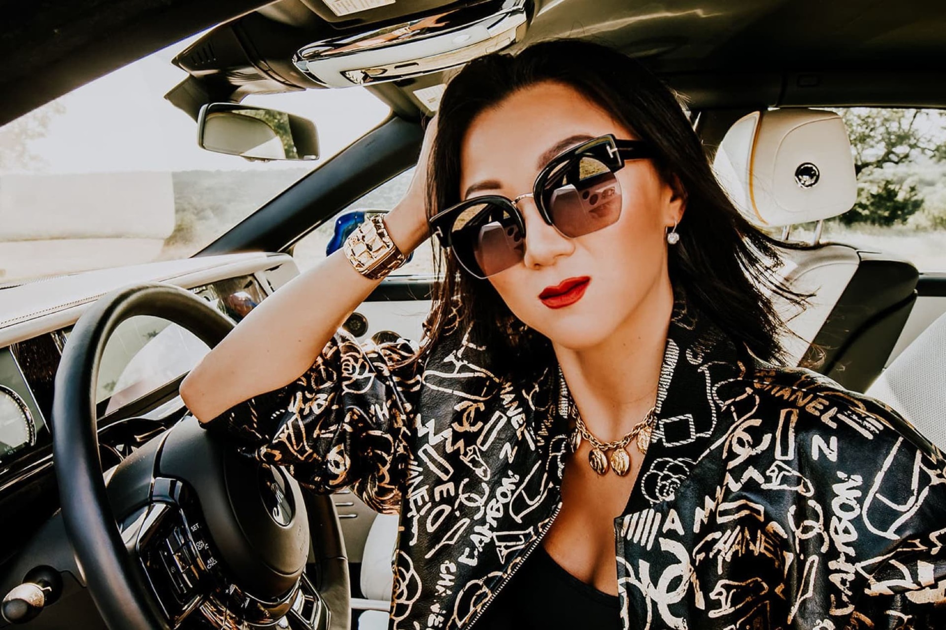 A profile shot of Alexandra Park Souto taken through the drivers window of her Rolls-Royce Phantom