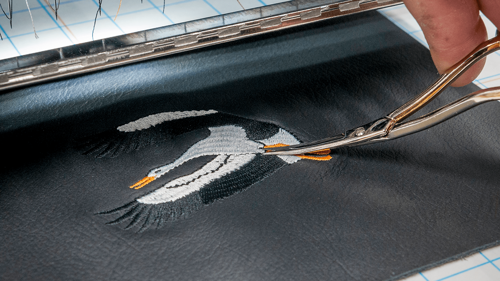 Embroidery of a bird for a bespoke car seat