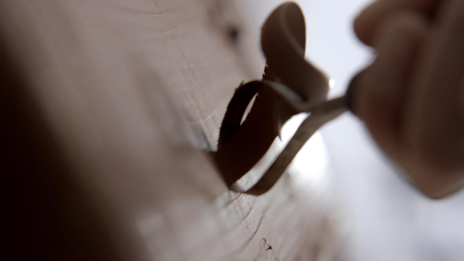 Peeling a material to reveal wooden touch