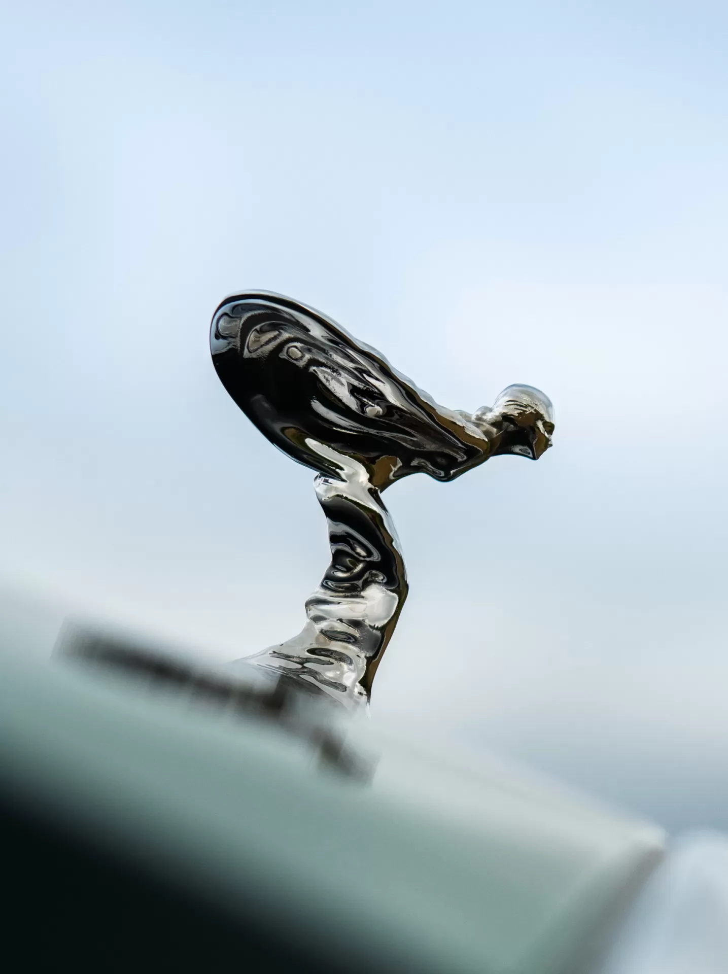 Close up shot of the spirit of ecstasy in silver colour. 
