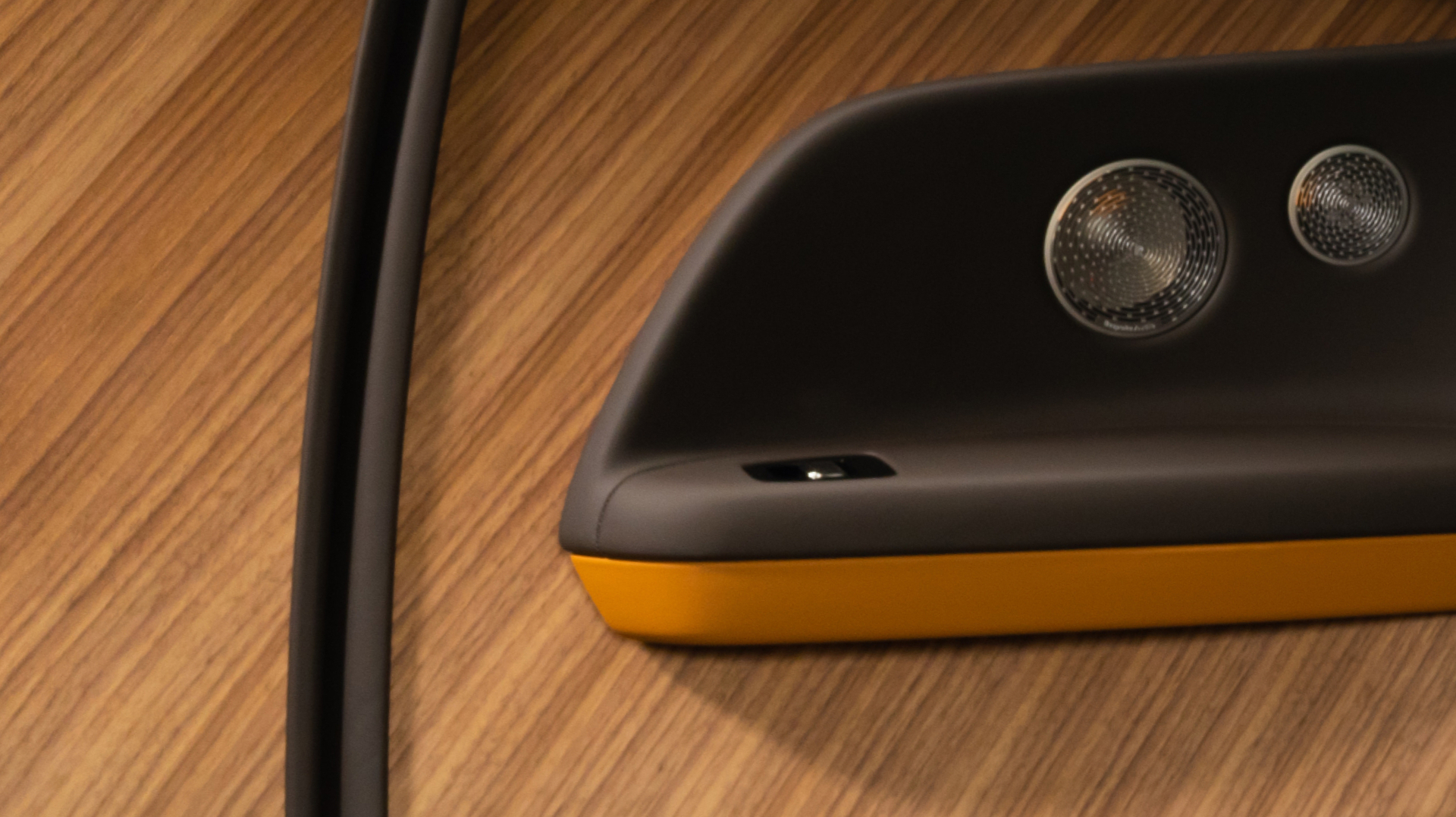 Shot of the wood accent with orange and brown interior of the Spectre.