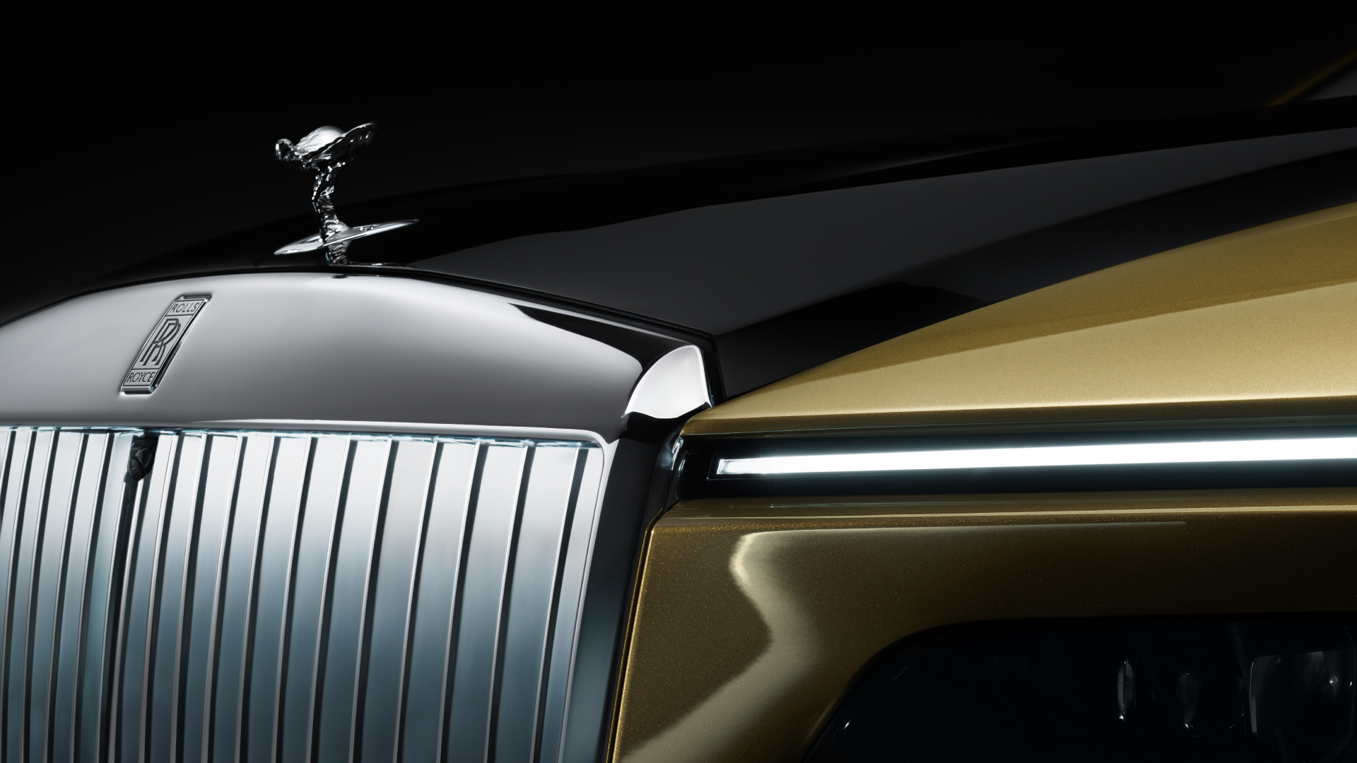 Front headlight of Spectre with Spirit of Ecstasy logo in the frame